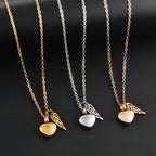 Urn necklace with angel wings and heart pendant gold