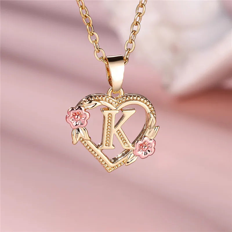 Necklace with heart and flower initial pendant k