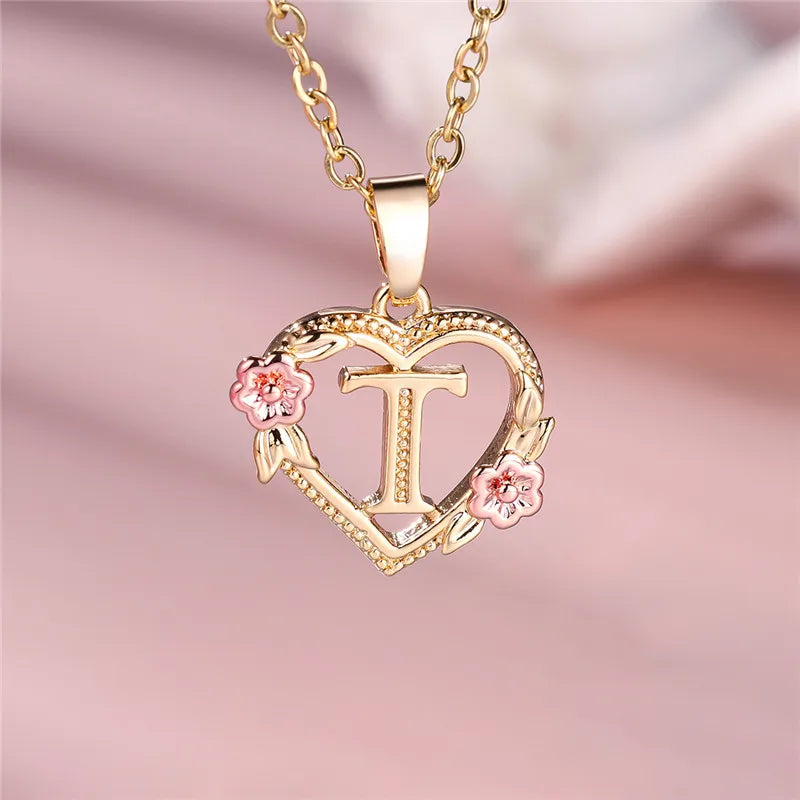 Necklace with heart and flower initial pendant t