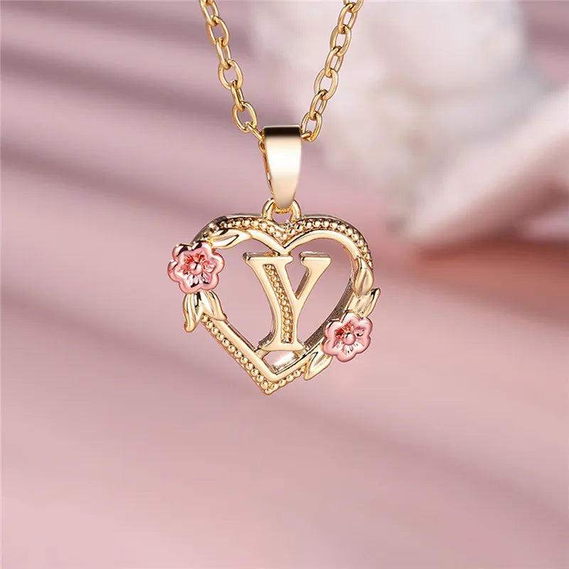 Necklace with heart and flower initial pendant y