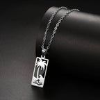 Necklace with palm tree and beach wave pendant in silver