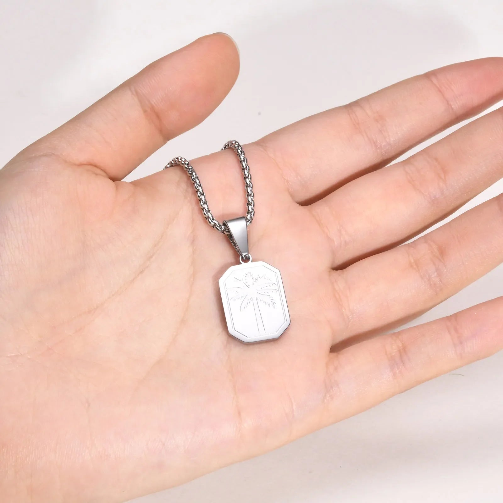 Necklace with geometric palm tree pendant silver