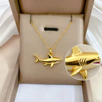 Necklace with gold shark pendant
