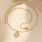 Necklace with round pendant and palm tree motif