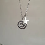 Necklace with spiral pendant and small star