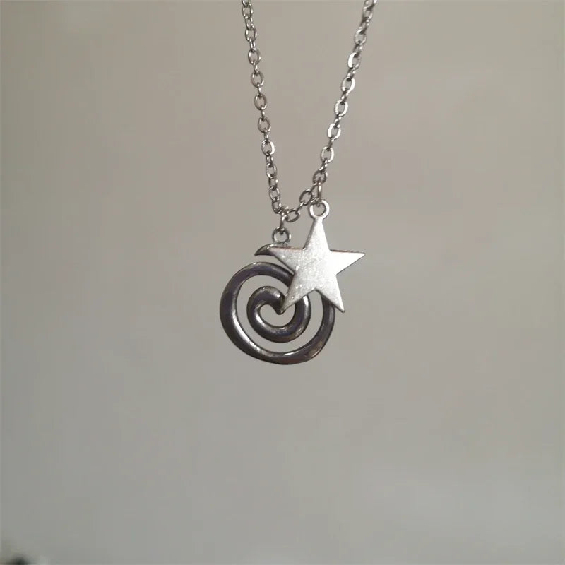 Necklace with spiral pendant and small star