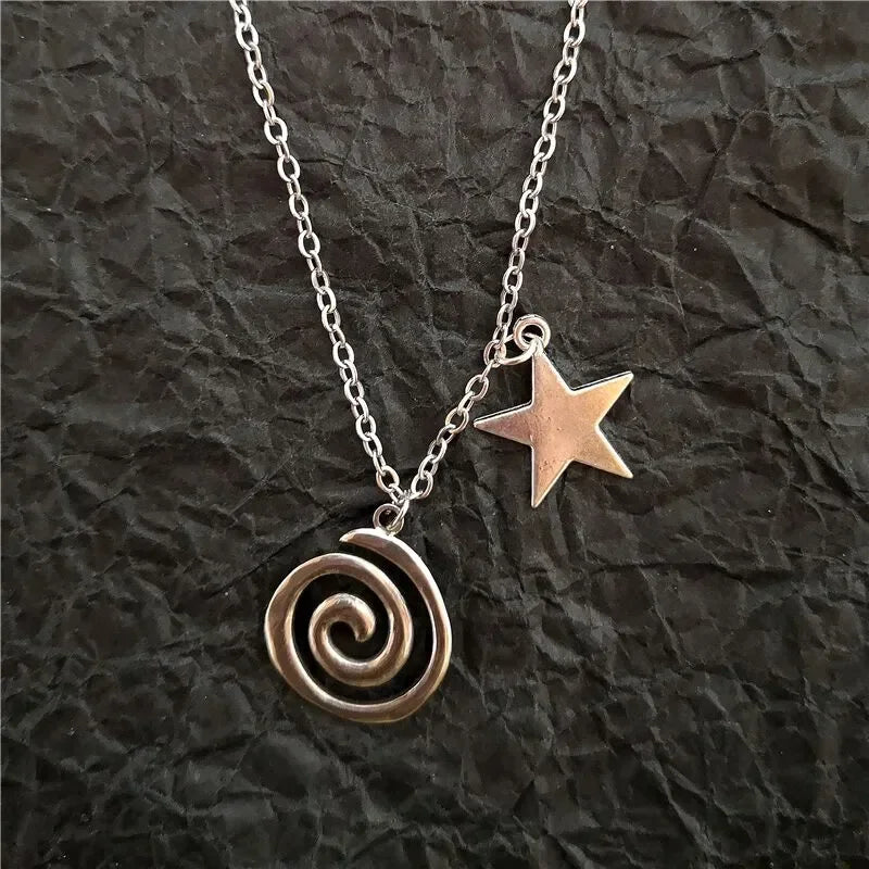 Necklace with spiral pendant and small star