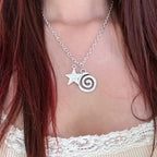 Necklace with spiral pendant and small star