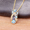 Necklace with Tongue, Blue Eye, and Zircon Pendant