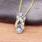 Necklace with Tongue, Blue Eye, and Zircon Pendant