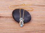 Necklace with Tongue, Blue Eye, and Zircon Pendant