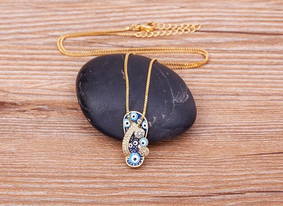 Necklace with Tongue, Blue Eye, and Zircon Pendant