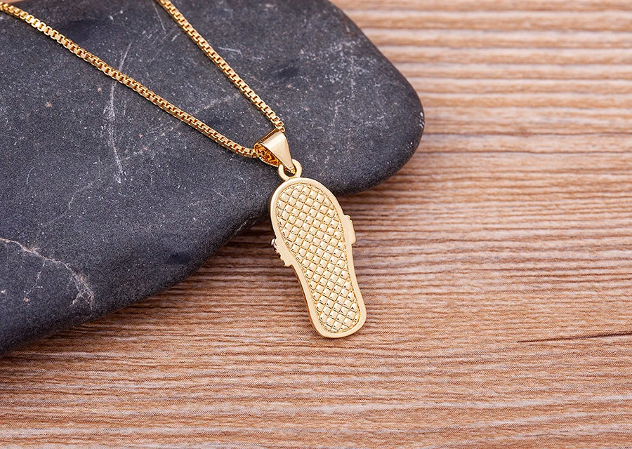 Necklace with Tongue, Blue Eye, and Zircon Pendant