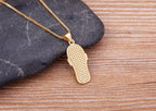 Necklace with Tongue, Blue Eye, and Zircon Pendant