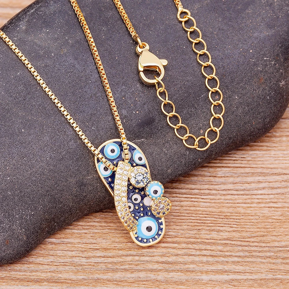 Necklace with Tongue, Blue Eye, and Zircon Pendant