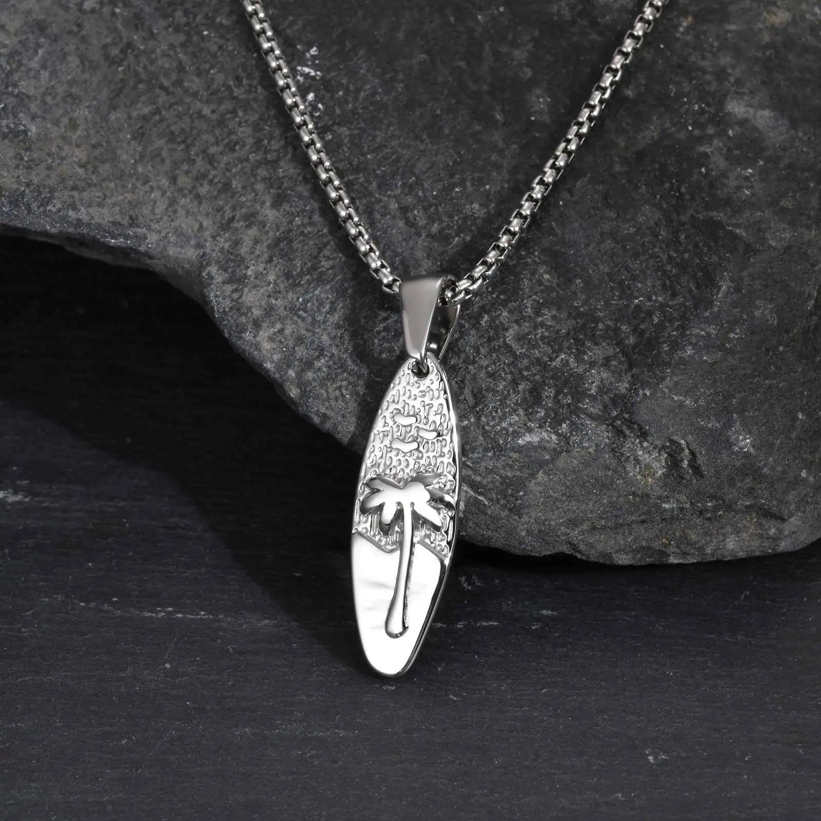 Necklace with small palm tree and sea pendant in silver
