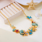 Gold and blue seashell necklace