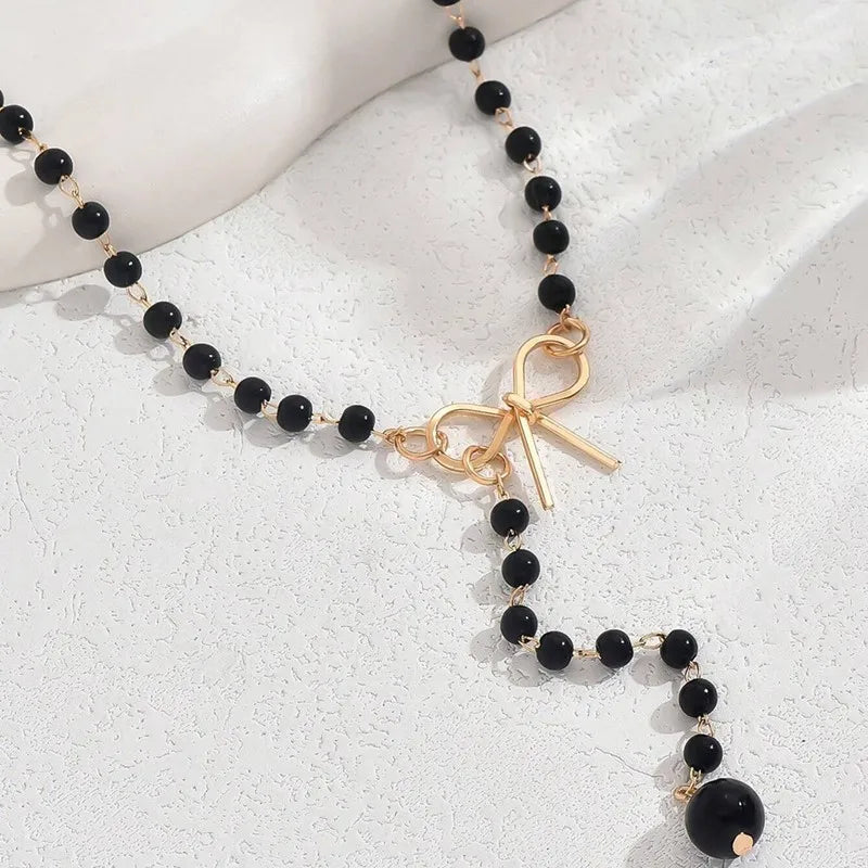 Pearl Necklace with Black Bow Pendant