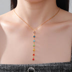 Protective Necklace with Long Pendant in 7 Chakra Stones gold