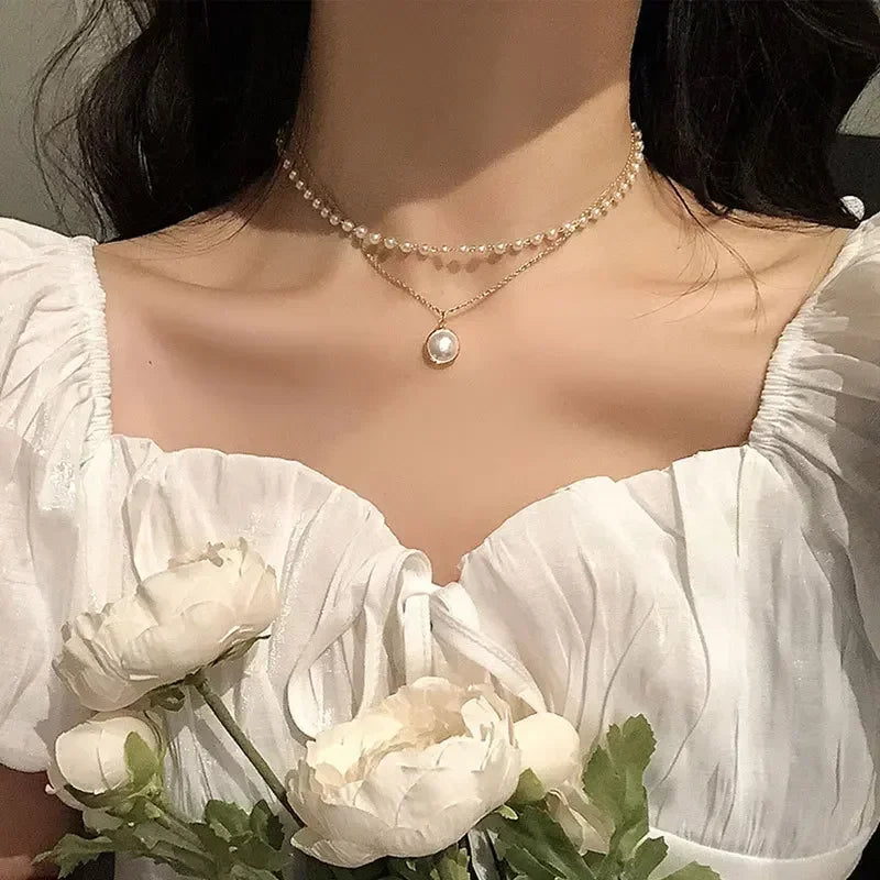 Elegant Double Necklace with Pearl Pendant in gold