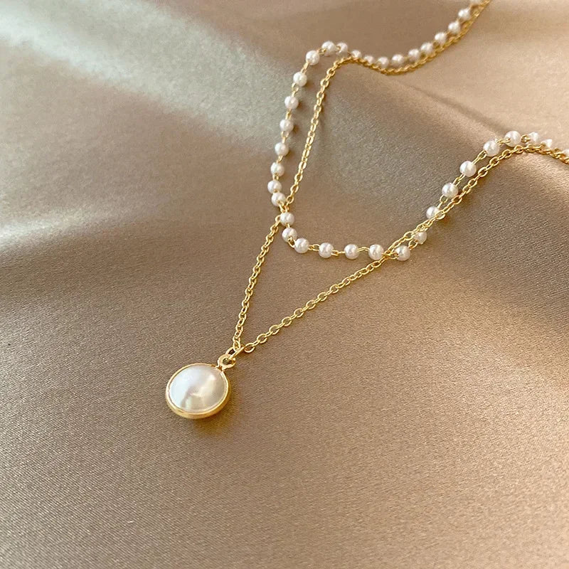 Elegant Double Necklace with Pearl Pendant in gold