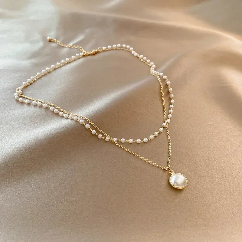 Elegant Double Necklace with Pearl Pendant in gold