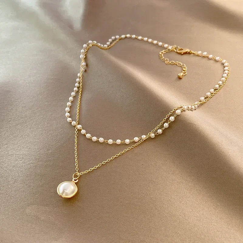 Elegant Double Necklace with Pearl Pendant in gold