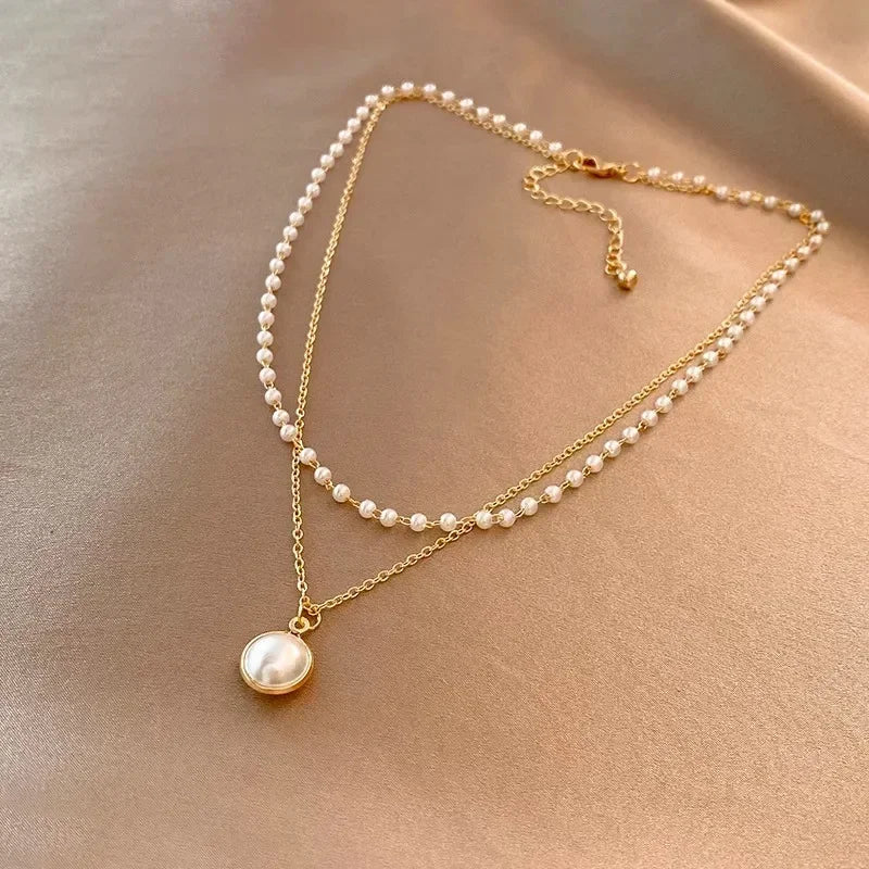 Elegant Double Necklace with Pearl Pendant in gold