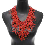 Coral red bib necklace and pendant