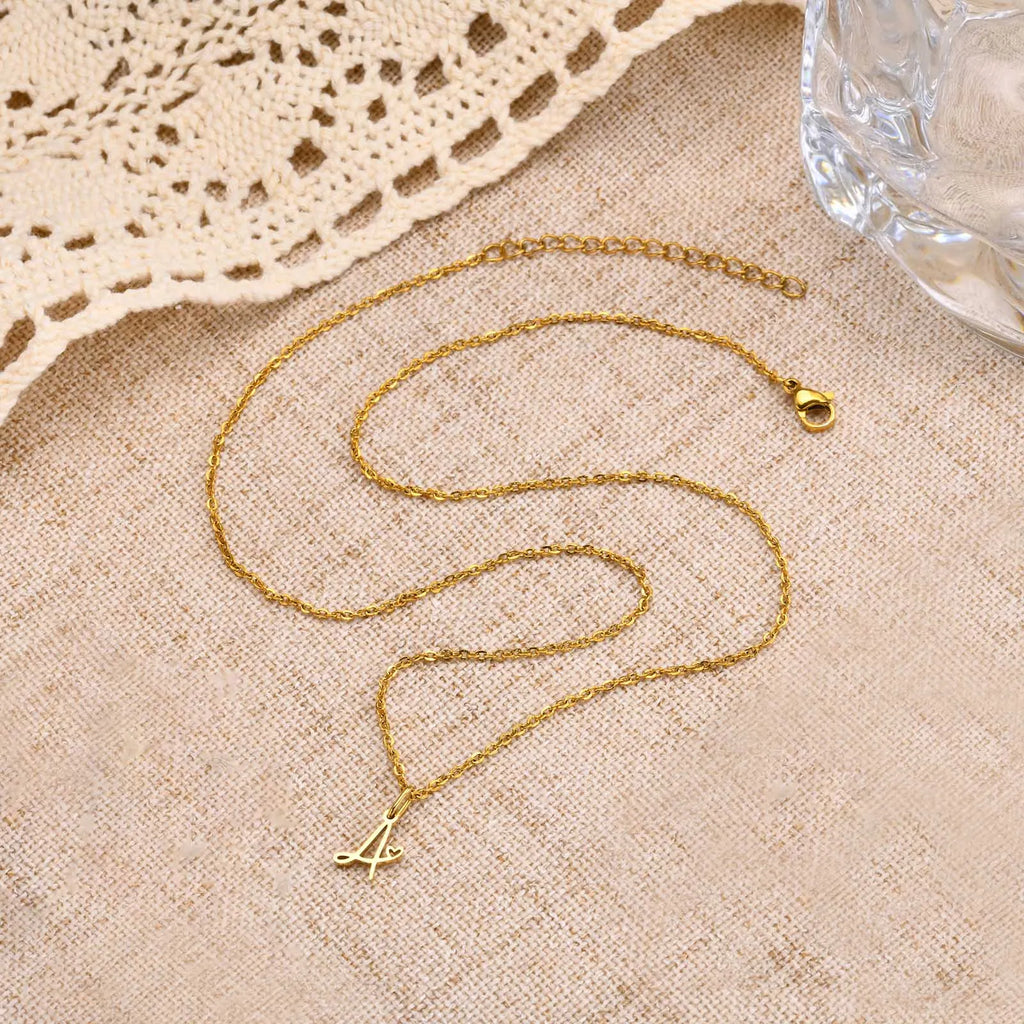 Women's necklace with letter initial pendant and heart