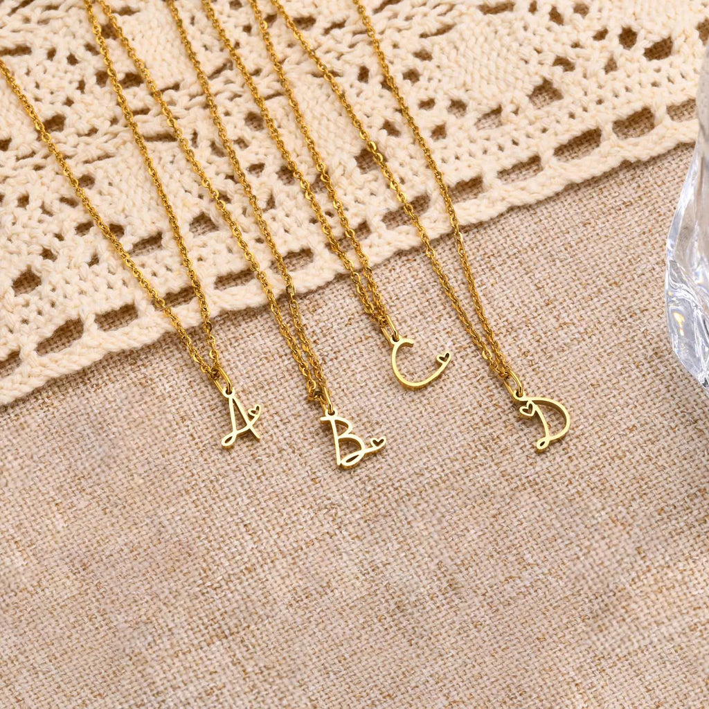 Women's necklace with letter initial pendant and heart