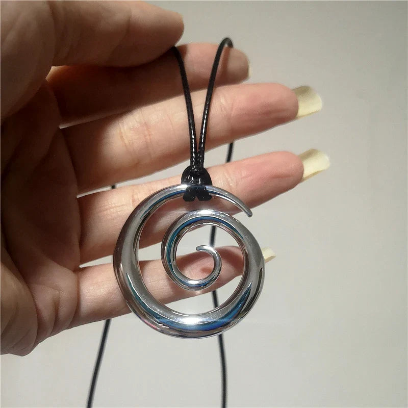 Long necklace with silver spiral pendant