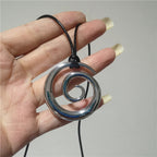 Long necklace with silver spiral pendant