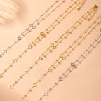 Long Necklace with Four-Leaf Clover and Zircon Pendants gold