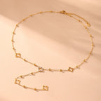 Long Necklace with Four-Leaf Clover and Zircon Pendants gold