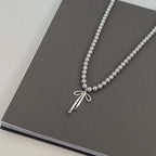 Pendant Necklace with Gray Pearls and Bow Tie 