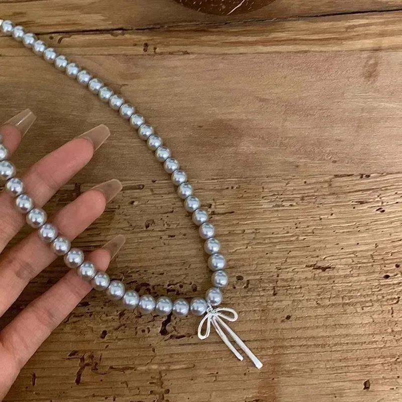 Pendant Necklace with Gray Pearls and Bow Tie 
