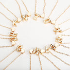Women's necklace with initial and heart pendant