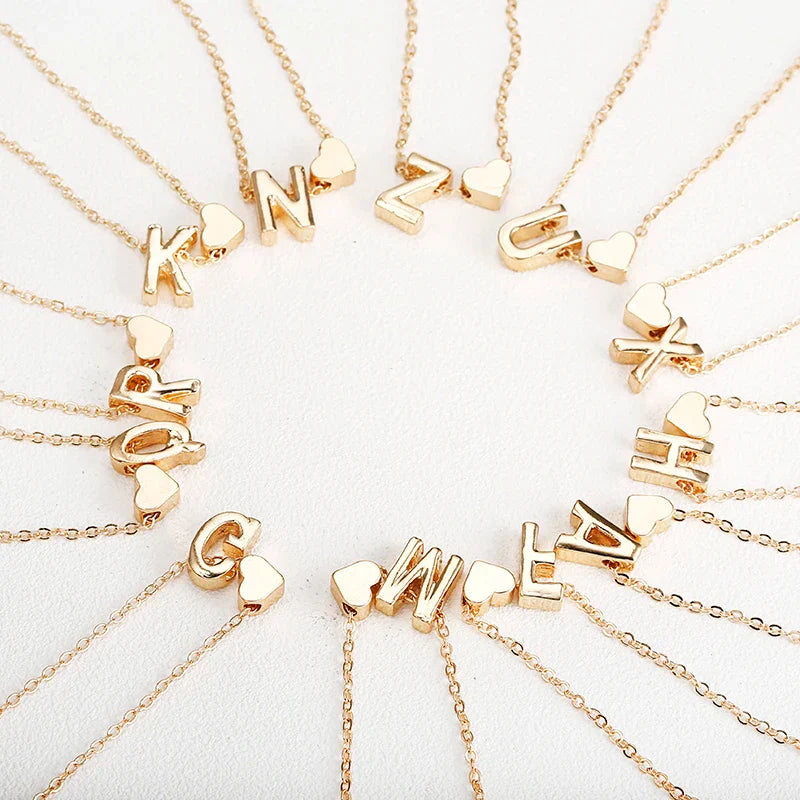 Women's necklace with initial and heart pendant