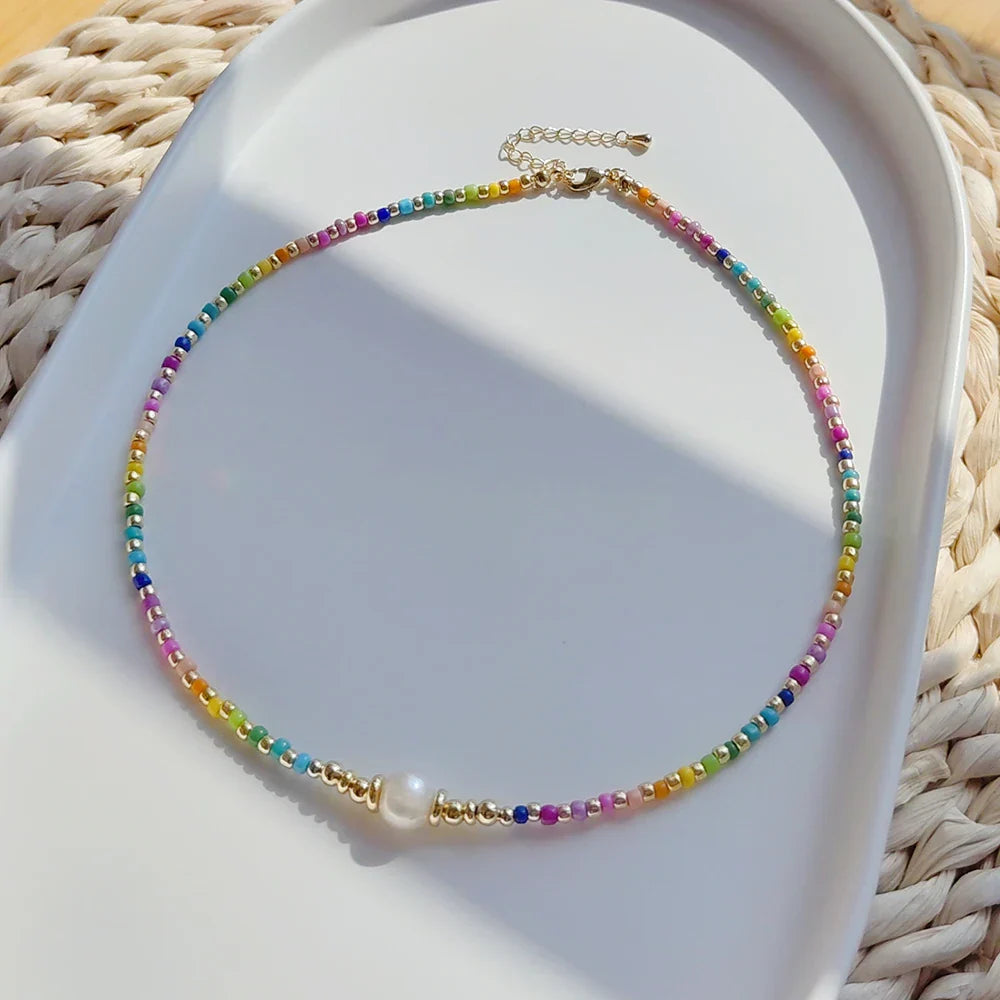 Choker necklace with rainbow pendant and pearls