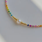 Choker necklace with rainbow pendant and pearls