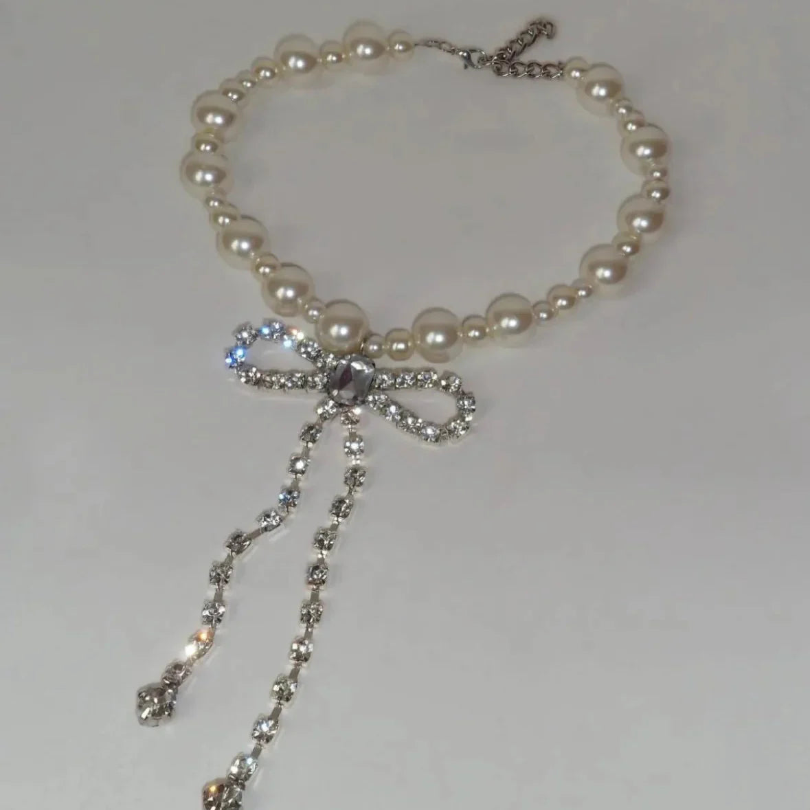 Choker necklace with rhinestone bow tie pendant