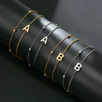Double initial bracelet gold and silver