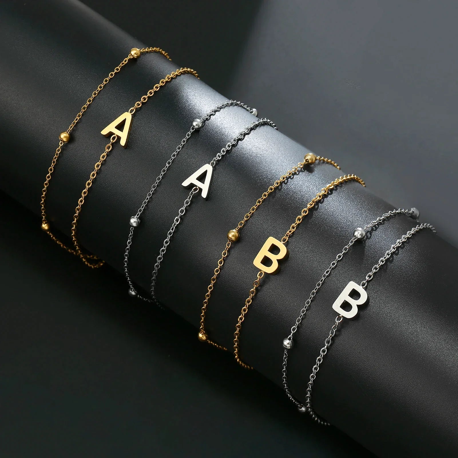 Double initial bracelet gold and silver