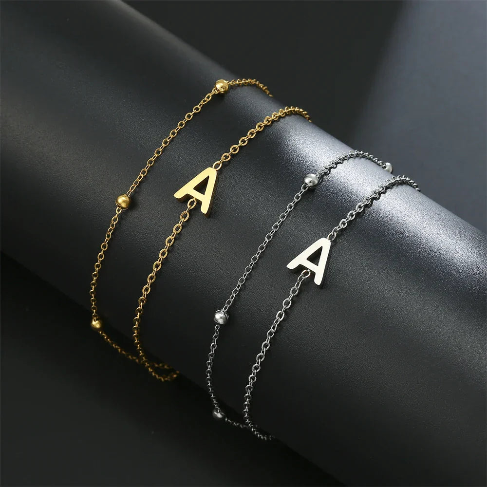 Double initial bracelet gold and silver  a