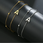 Double initial bracelet gold and silver a