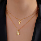 Double necklace with gold key and padlock pendant