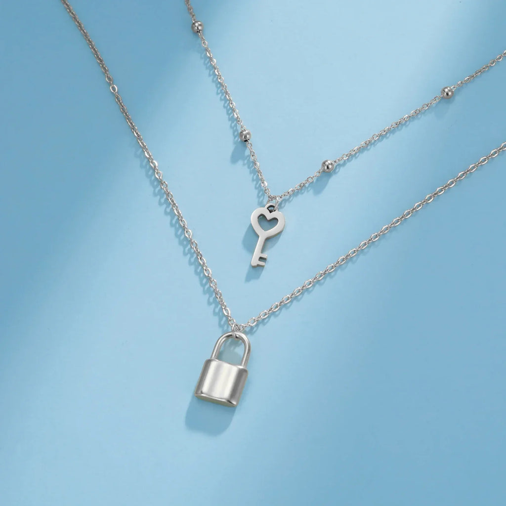 Double necklace with silver key and padlock pendant