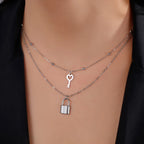 Double necklace with silver key and padlock pendant