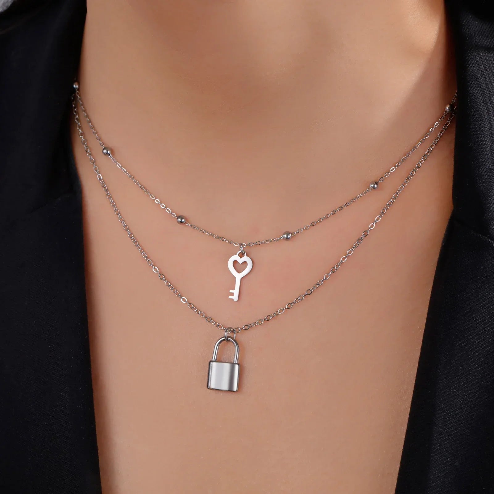 Double necklace with silver key and padlock pendant